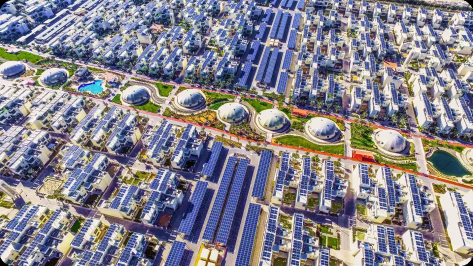 Aerial view of The Sustainable City in Dubai with solar panels on every roof